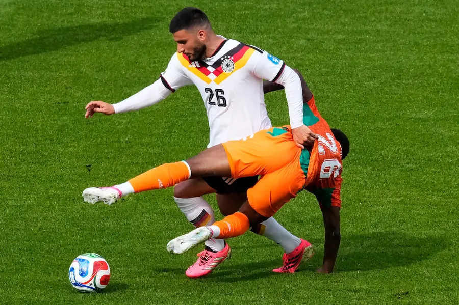 Germany's Deniz Undav battles for the ball with Ivory Coast's Christ Inao Oulai