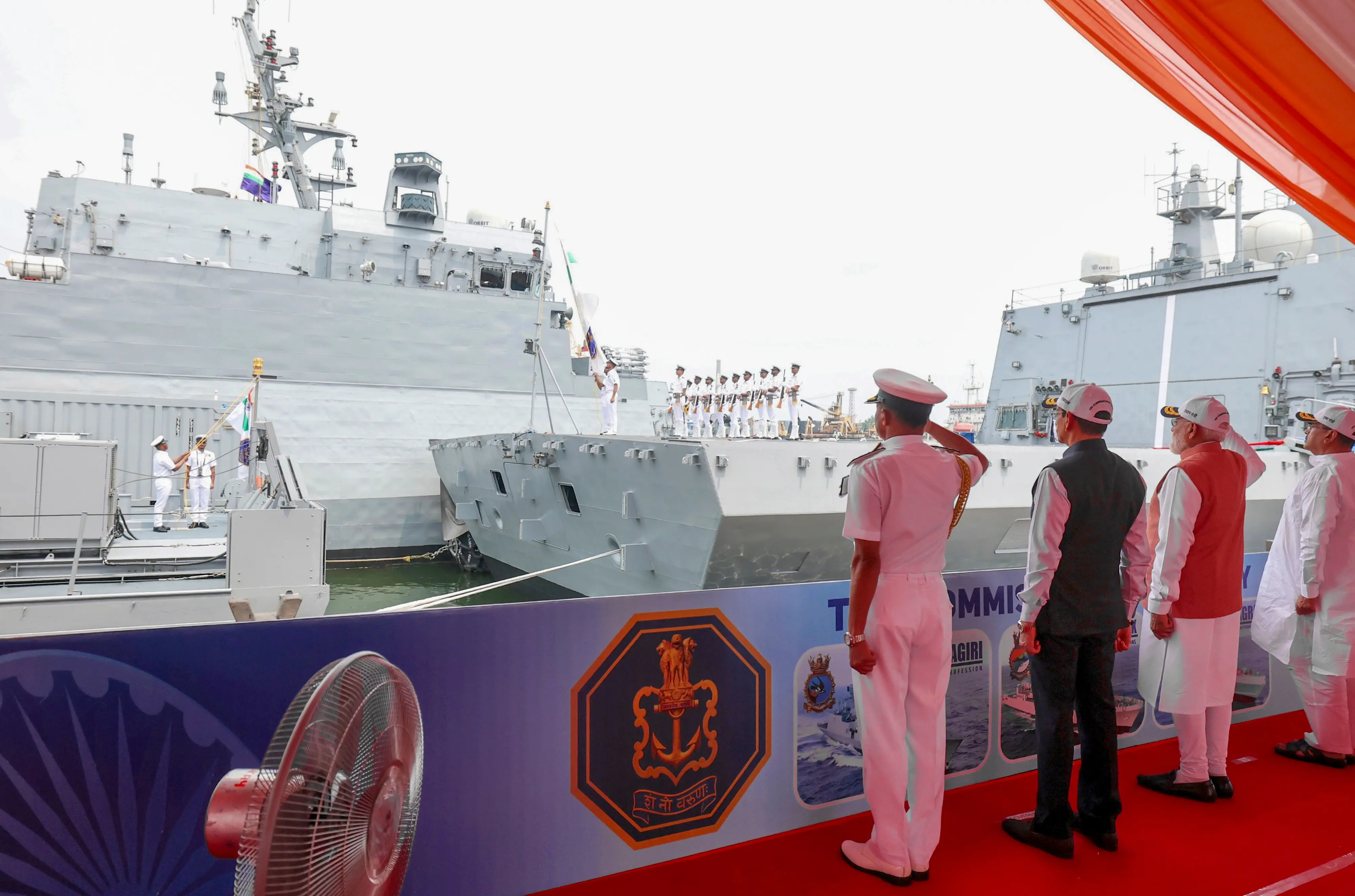 Prime Minister Narendra Modi, West Bengal Chief Minister Suvendu Adhikari, Governor RN Ravi and Chief of the Naval Staff Admiral Krishna Swaminathan during the tri-commissioning ceremony of INS Dunagiri, INS Sanshodhak and INS Agray at Syama Prasad Mookerjee Port