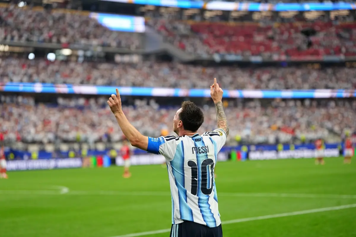 Argentina's Lionel Messi celebrates after scoring his side's second goal during the World Cup Group J football match between Argentina and Austria | Photo: AP