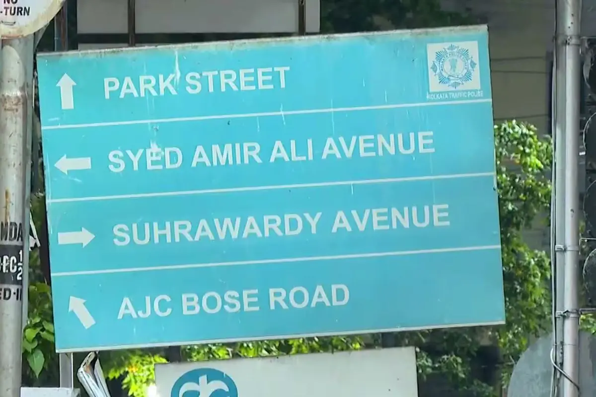 A road sign points towards Suhrawardy Avenue in Kolkata. The Kolkata Municipal Corporation has renamed the stretch as Gopal Mukherjee Road, triggering a political and historical debate over the legacy of the Suhrawardy name. (Photo: X)