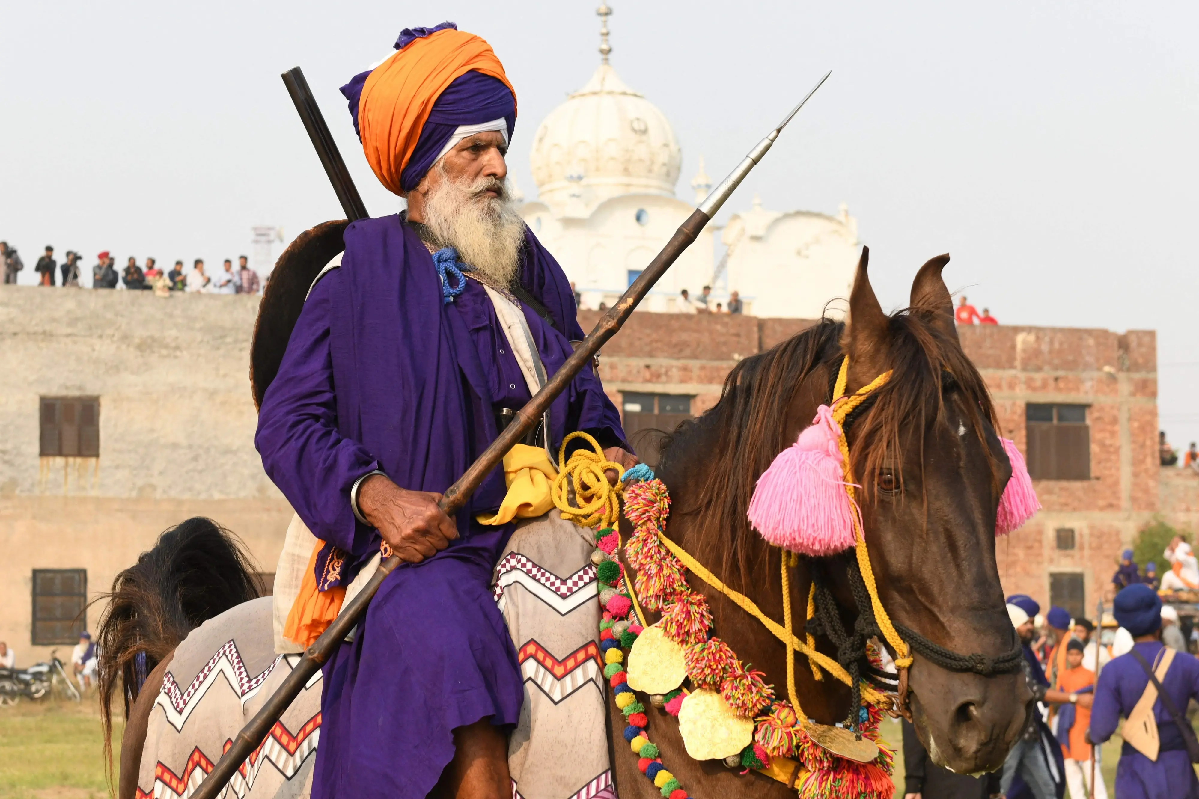A Nihang or Sikh warrior arrives during a Fateh Divas celebration a day after the Hindu festival Diwali, in Amritsar.| Photo: AFP