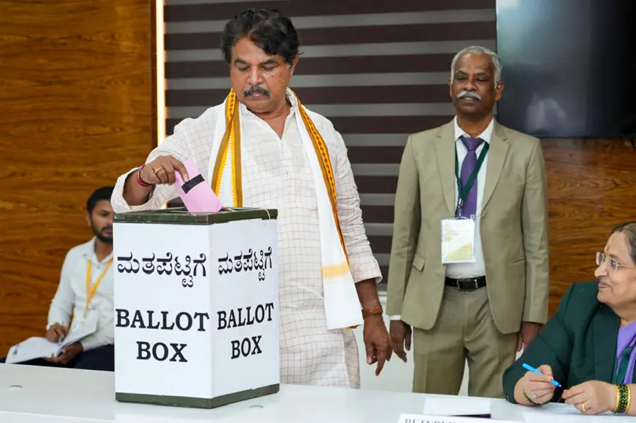 Leader of the Opposition of the Karnataka Legislative Assembly R Ashoka casts his vote during the biennial elections to seven seats of the Karnataka Legislative Council