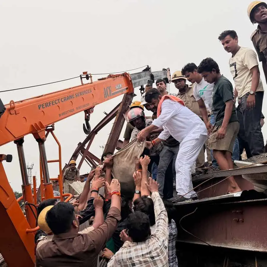 Rescue personnel, local volunteers and workers carry out operations after an under-construction factory shed collapsed in Kolkata's Taratala area on Wednesday, with several injured and 23 feared trapped beneath the debris.