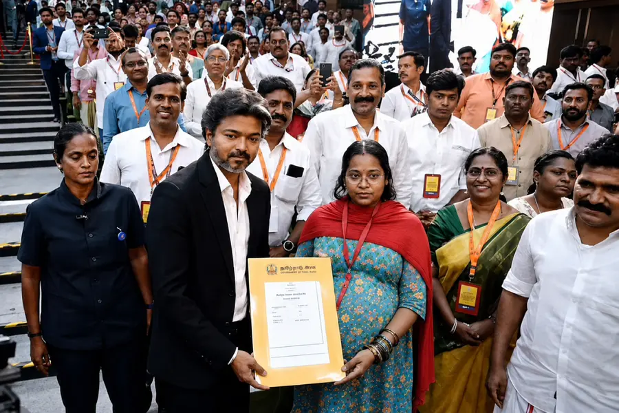 Tamil Nadu CM Vijay Breaks Protocol To Step Off Stage And Deliver Appointment Letter To Pregnant Woman