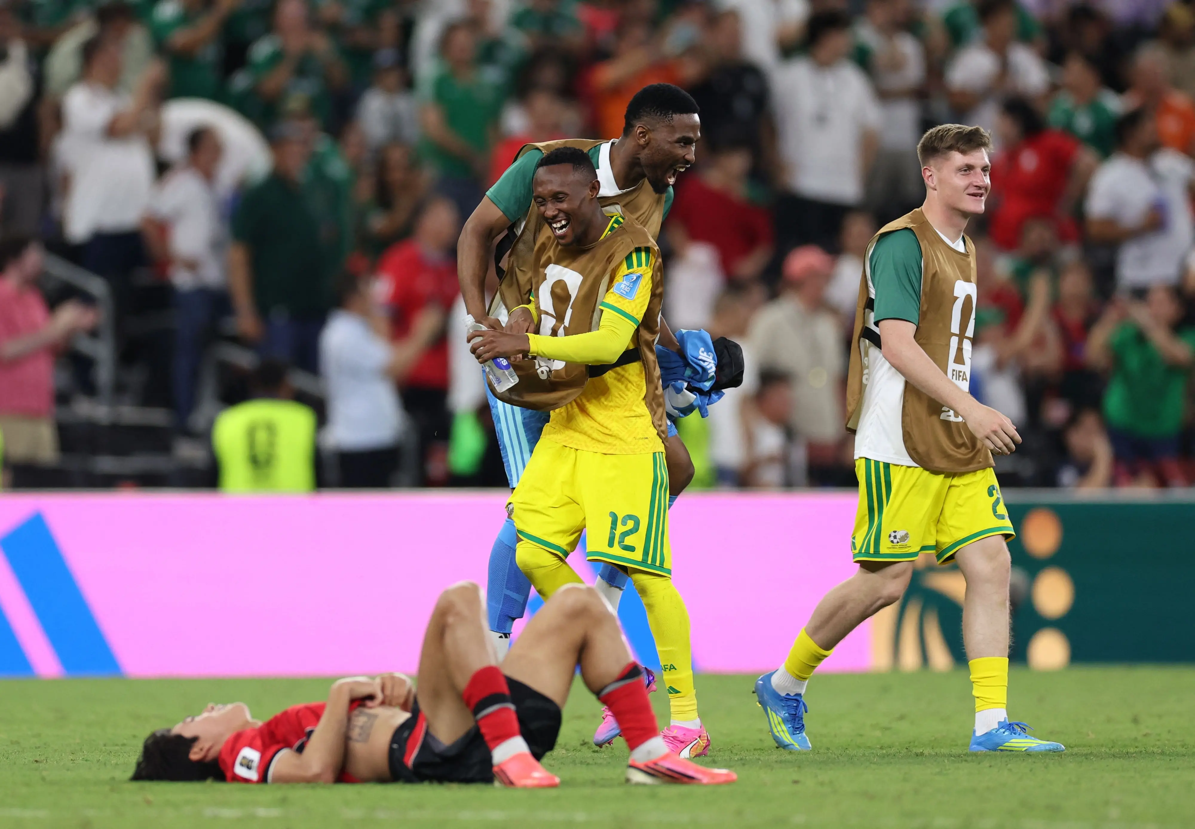 South Africa's forward Thapelo Maseko celebrates with teammates after the 1-0 victory | AFP