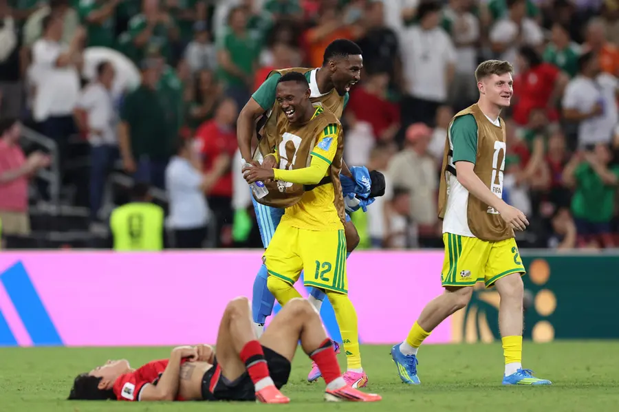 South Africa's forward Thapelo Maseko celebrates with teammates after the 1-0 victory