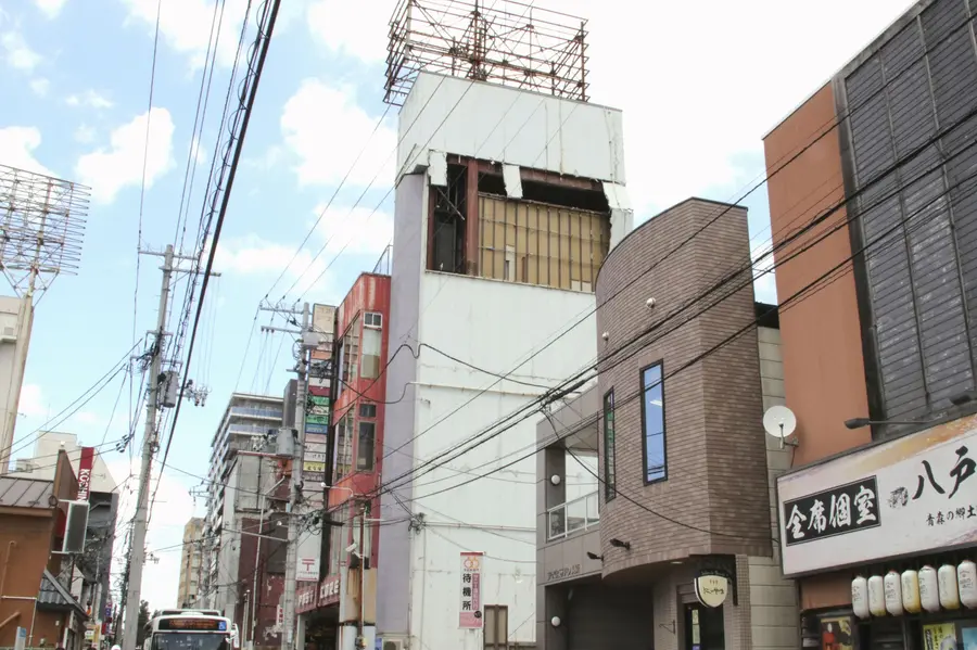 The wall of a building is seen partly damaged following an earthquake in Hachinohe