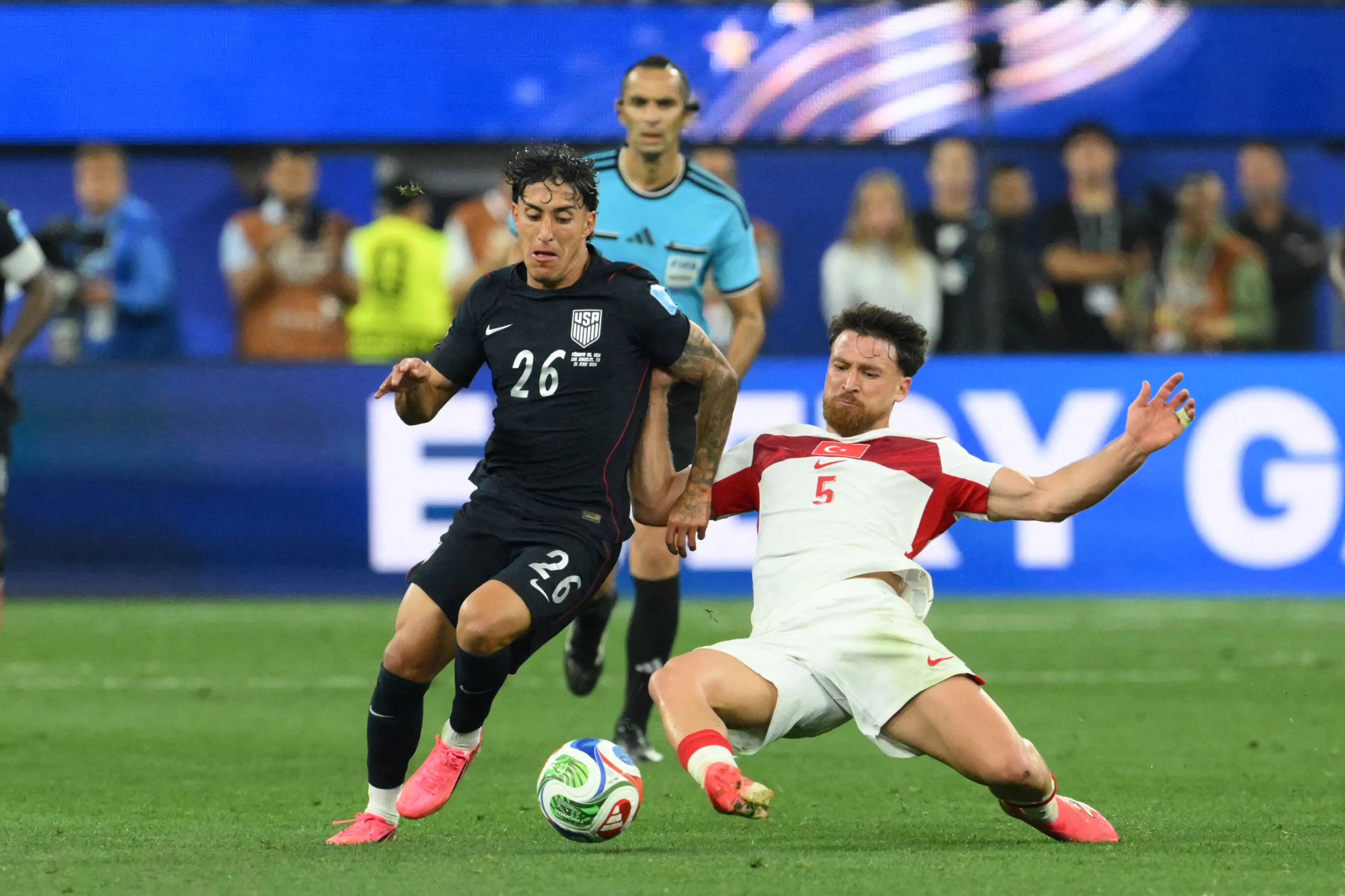 US forward Alex Zendejas and Turkey's midfielder Salih Ozcan fight for the ball during the 2026 World Cup Group D football match between Turkey and USA | AFP