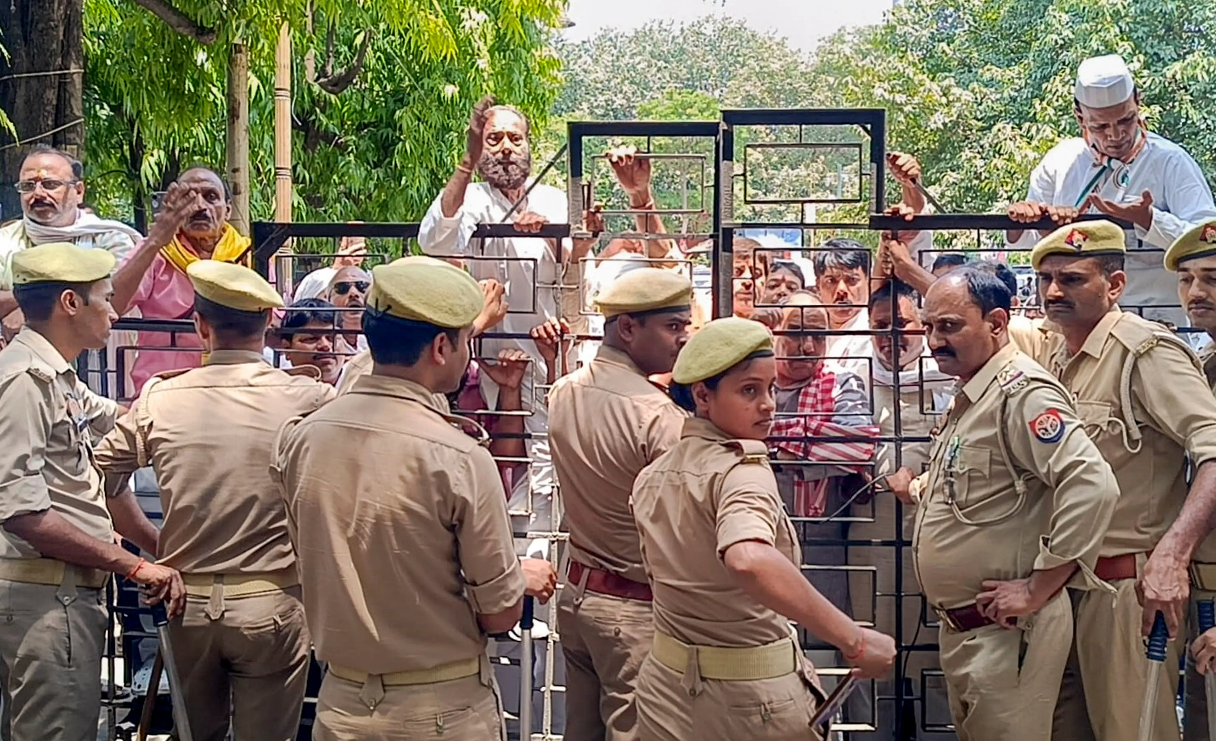 Congress workers protest outside the district headquarters over the alleged theft of donation deeds linked to the Shri Ram Temple in Ayodhya, in Varanasi.| Photo: PTI