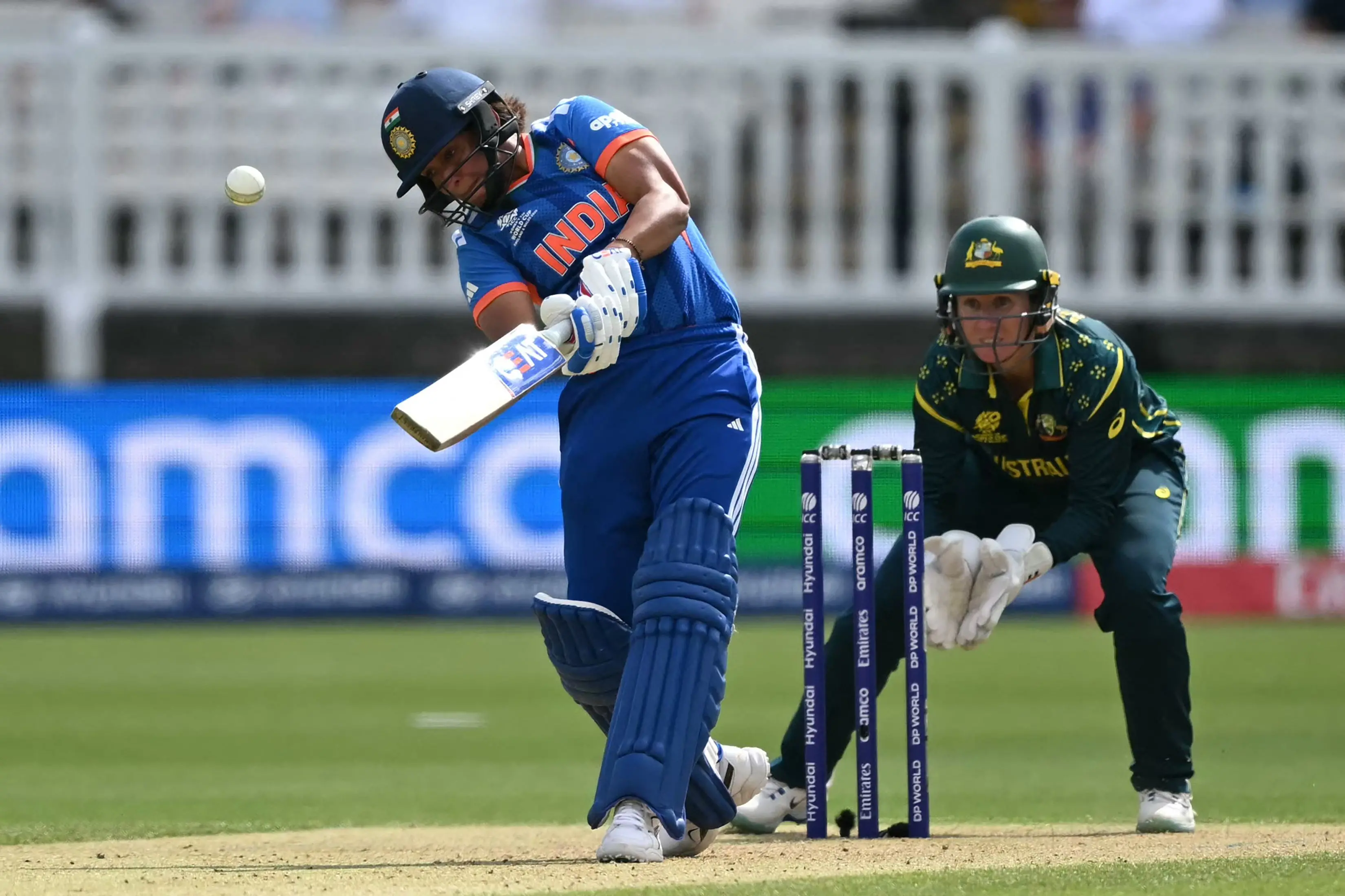 India's captain Harmanpreet Kaur hits a six during the ICC Women's T20 cricket world cup 2026 game between Australia and India | AFP