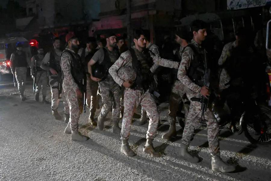 Paramilitary soldiers return after completing an operation following a militant attack on Pakistan's Security Rangers compound in Karachi