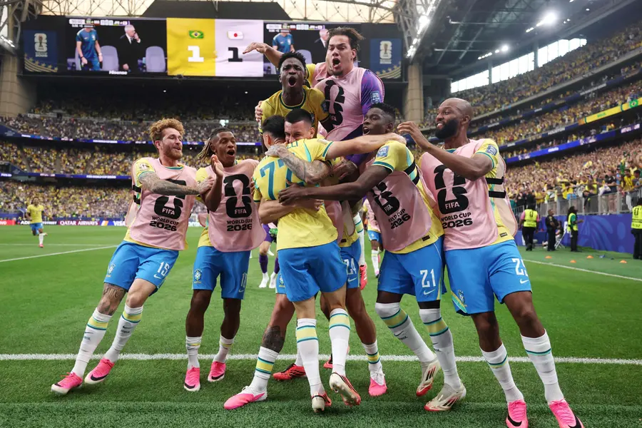 Gabriel Martinelli celebrates with teammates after scoring the team's second goal