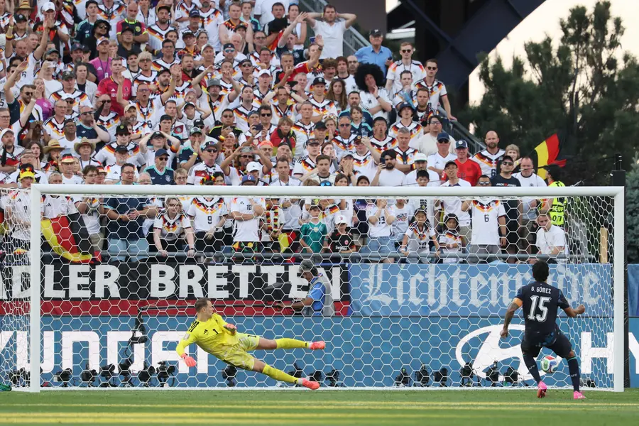 Paraguay's defender Gustavo Gomez scores a penalty kick past Germany's goalkeeper Manuel Neuer during the penalty shootout | AFP