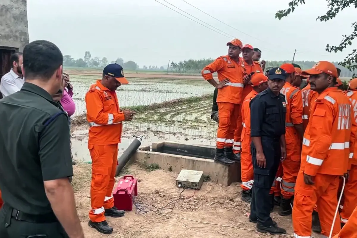 NDRF, SDRF Haryana, police and Army personnel conduct rescue operation at the site after a 4-year-old boy fell into a borewell at Dhanyora Village, in Ambala on Tuesday. (ANI Video Grab)