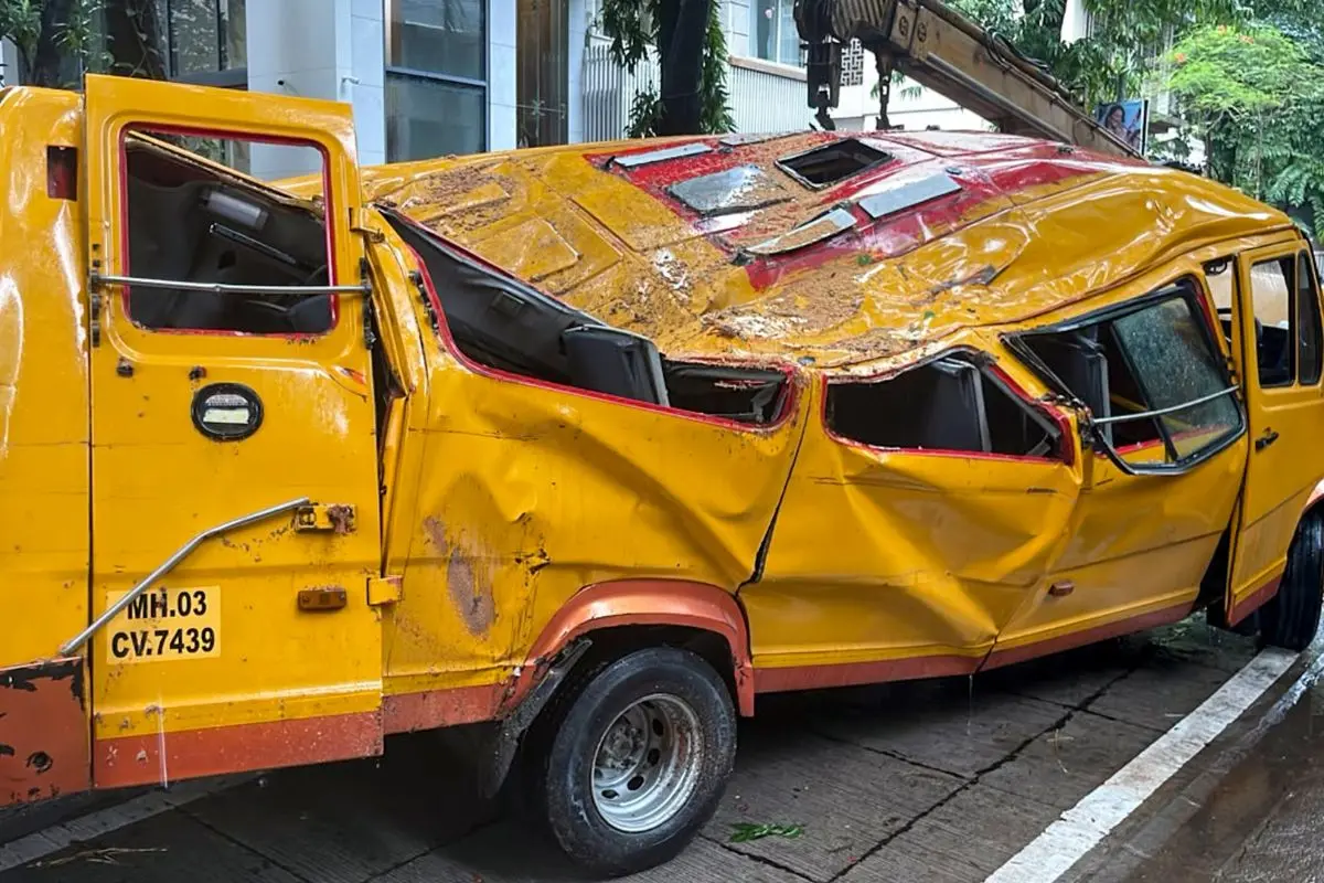 Mangled remains of the school bus after a tree fell on it in Chembur, Mumbai, Tuesday, June 30, 2026. An 11-year-old student was killed and four others were injured in the incident. (PTI Photo)