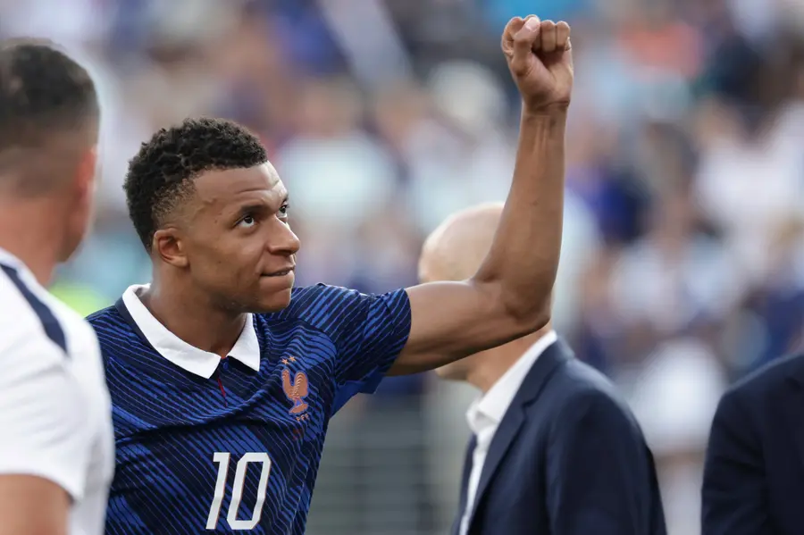 France's Kylian Mbappe celebrates their win after the World Cup round of 32 soccer match between France and Sweden