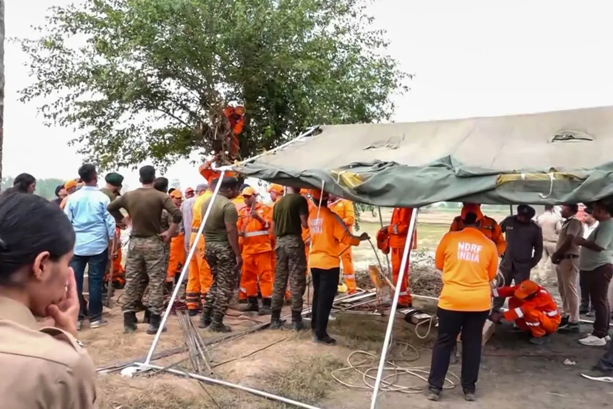 Personnel of the National Disaster Response Force (NDRF) and other rescue teams carry out a rescue operation after a four-year-old boy fell into an open borewell at Dhanaura village in Ambala district, Haryana, Tuesday, June 30, 2026 (Photo: PTI)