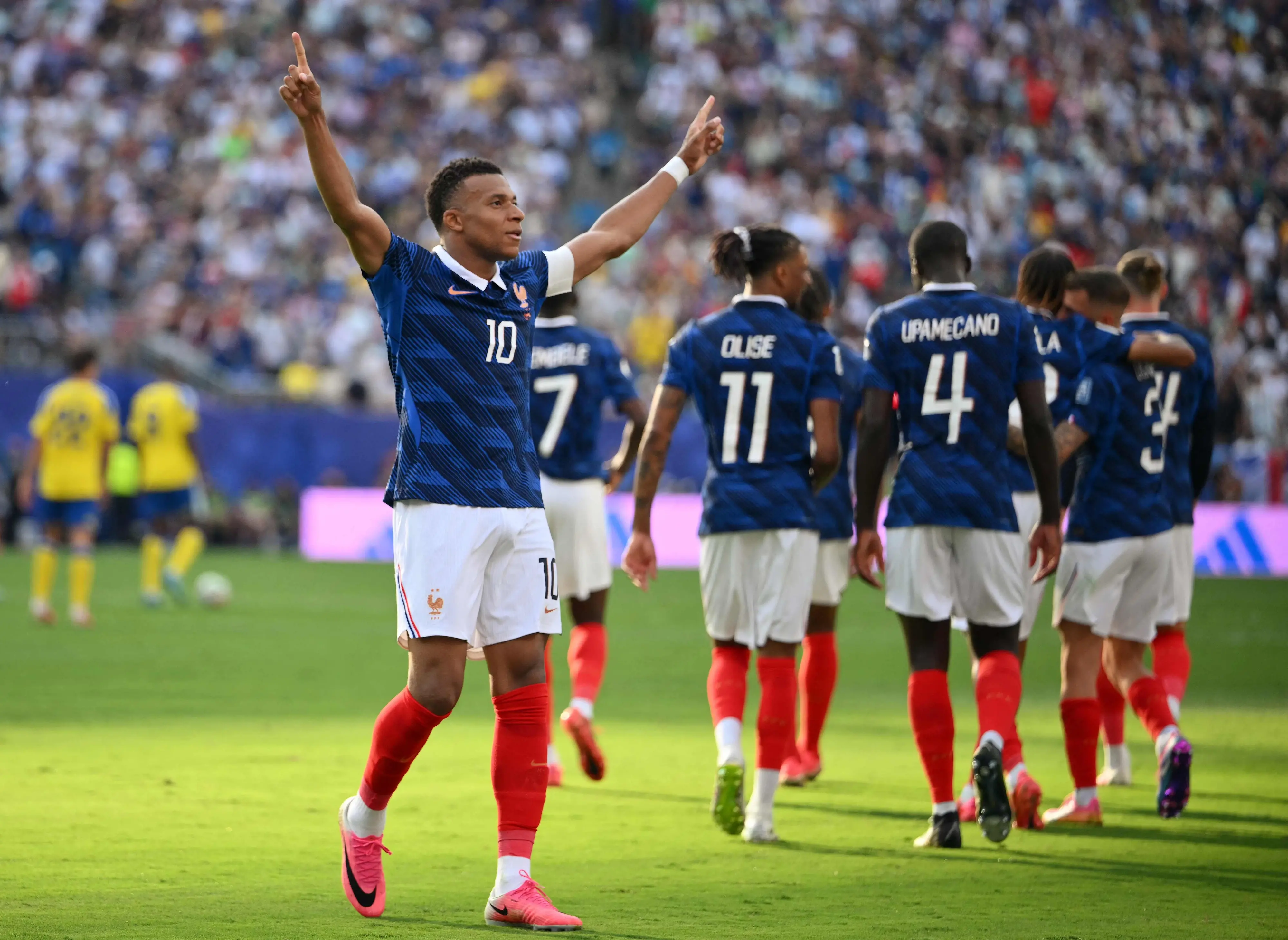 Kylian Mbappe celebrates scoring his team's third goal during the 2026 World Cup round of 32 football match between France and Sweden | AFP