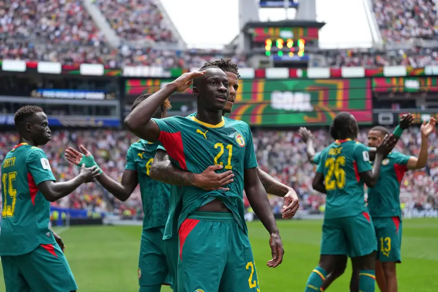 Senegal's Habib Diarra (21) celebrates scoring their first goal with Ismail Jakobs