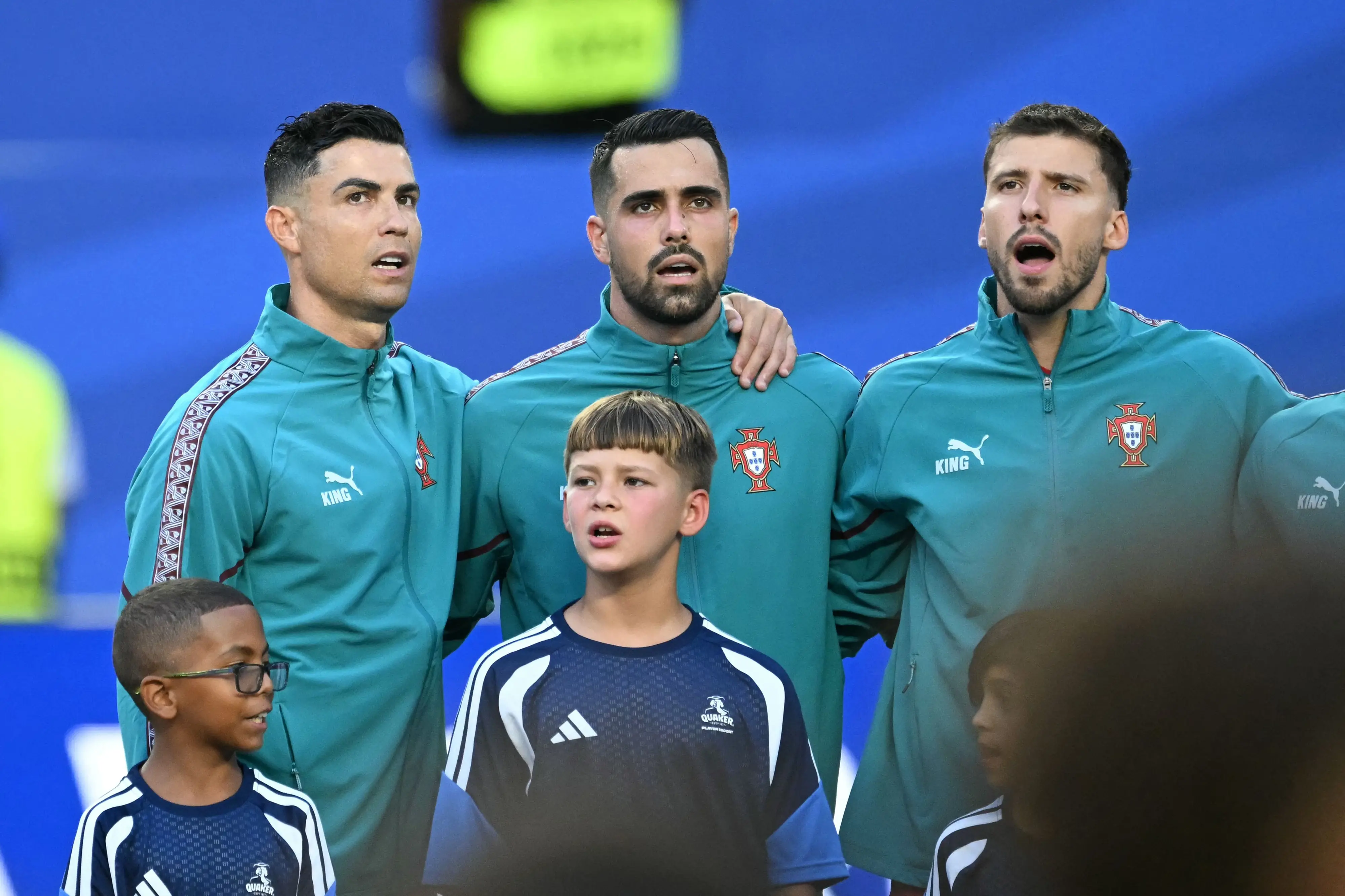Portugal's forward Cristiano Ronaldo, goalkeeper Diogo Costa, and defender Ruben Dias sing their national anthem | AFP