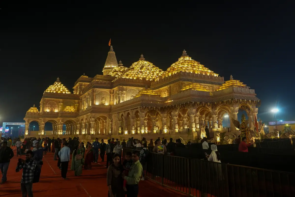 People visit the replica of Ayodhya's Ram Temple constructed at the Maha Kumbh Mela area, in Prayagraj, Uttar Pradesh.| File image: PTI