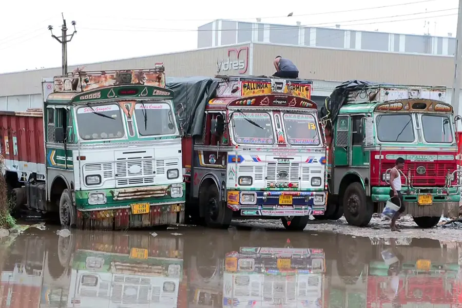 Vehicles stand at the waterlogged area due to heavy rain in Mehsana
