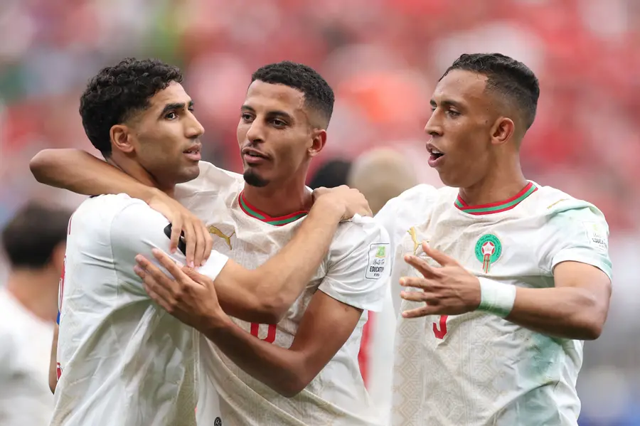Azzedine Ounahi of Morocco celebrates with teammates Achraf Hakimi and Soufiane Rahimi after scoring