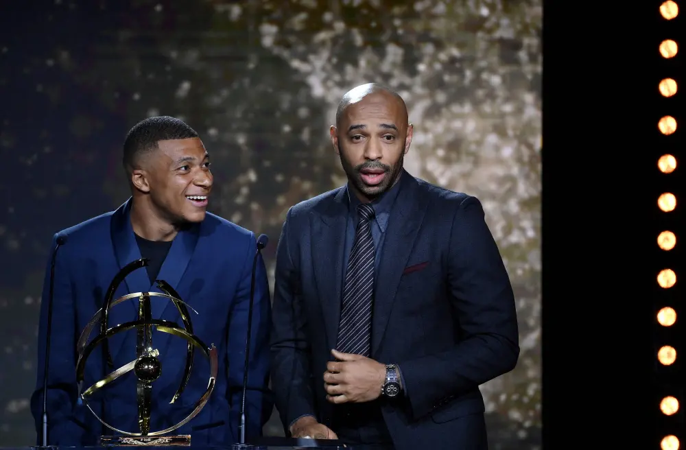 Kylian Mbappe (L) with Thierry Henry | AFP File