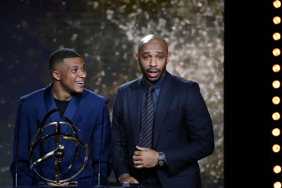 Kylian Mbappe (L) with Thierry Henry