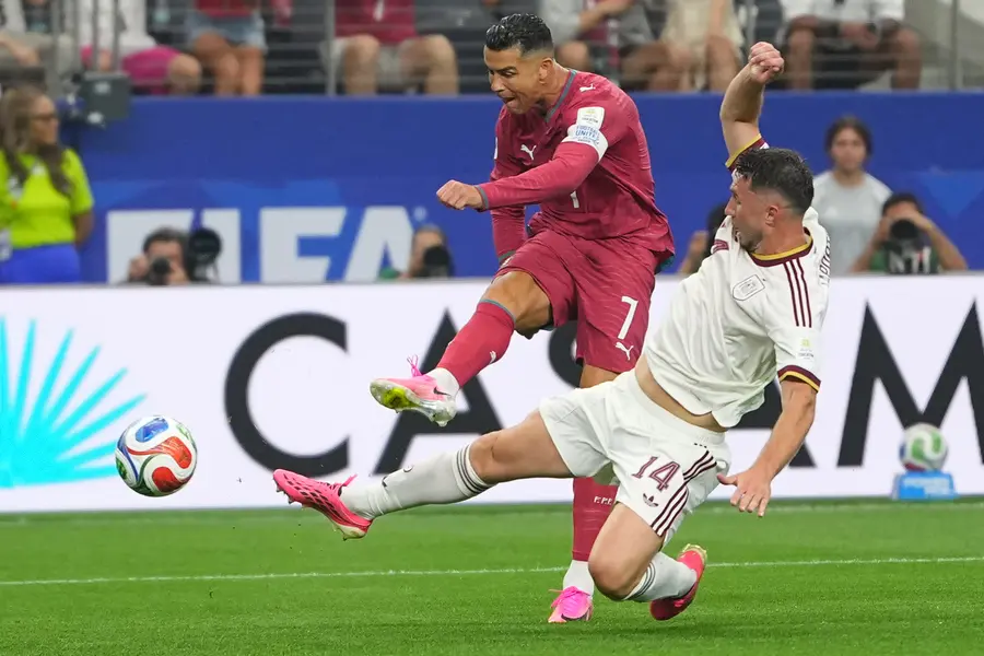 Ronaldo attempts a shot on goal challenged by Spain's Aymeric Laporte during the World Cup round of 16 soccer match | AP