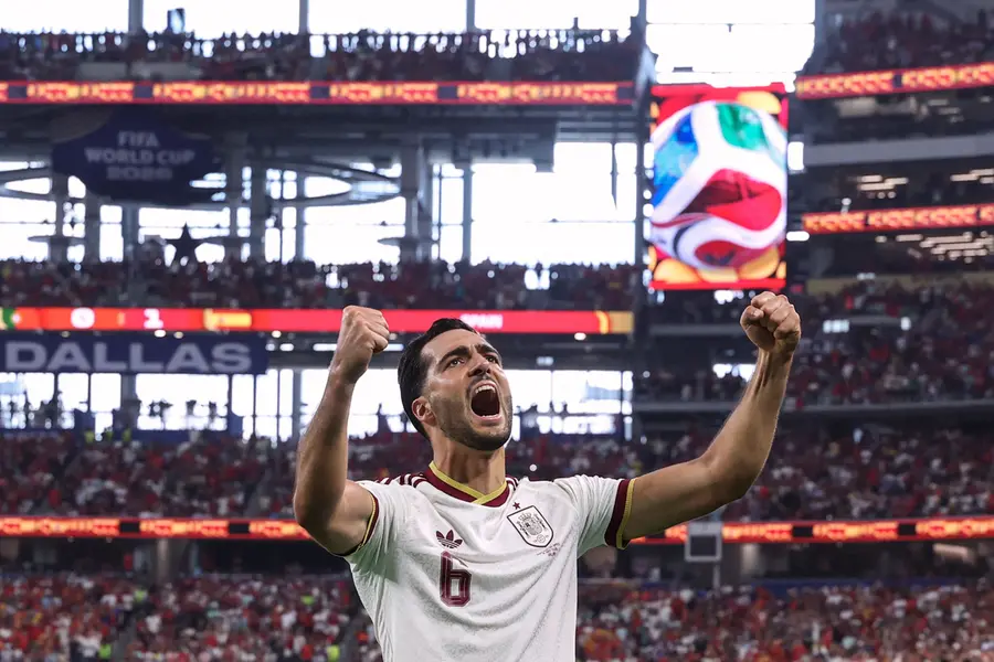 Spain's midfielder Mikel Merino celebrates scoring his team's first goal during the 2026 World Cup round of 16 football match between Portugal and Spain | AFP