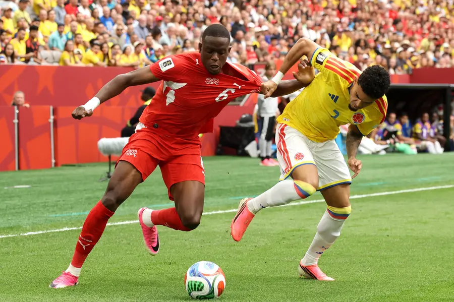 Denis Zakaria of Switzerland competes for the ball against Luis Diaz of Colombia