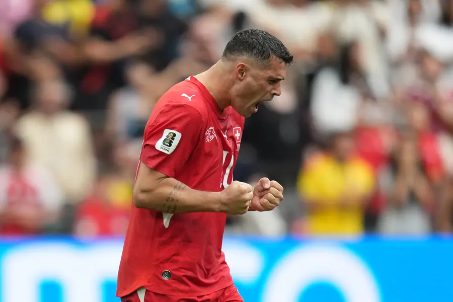 Switzerland's Granit Xhaka reacts after scoring during penalty shootout