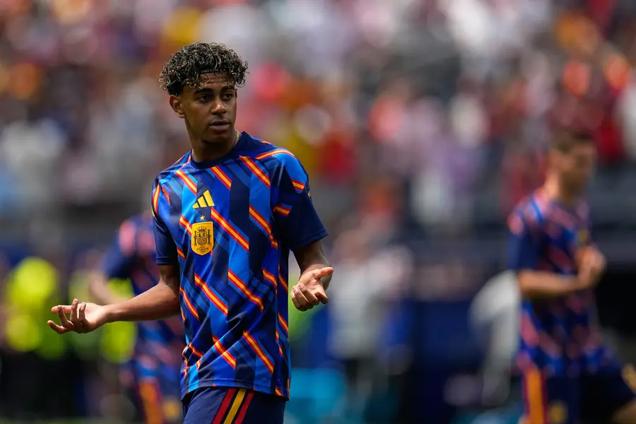Spain's Lamine Yamal warms up before the World Cup quarterfinal soccer match between Spain and Belgium