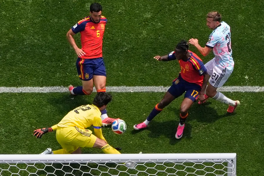 Spain's Mikel Merino scores their second goal during the World Cup quarterfinal soccer match between Spain and Belgium | AP