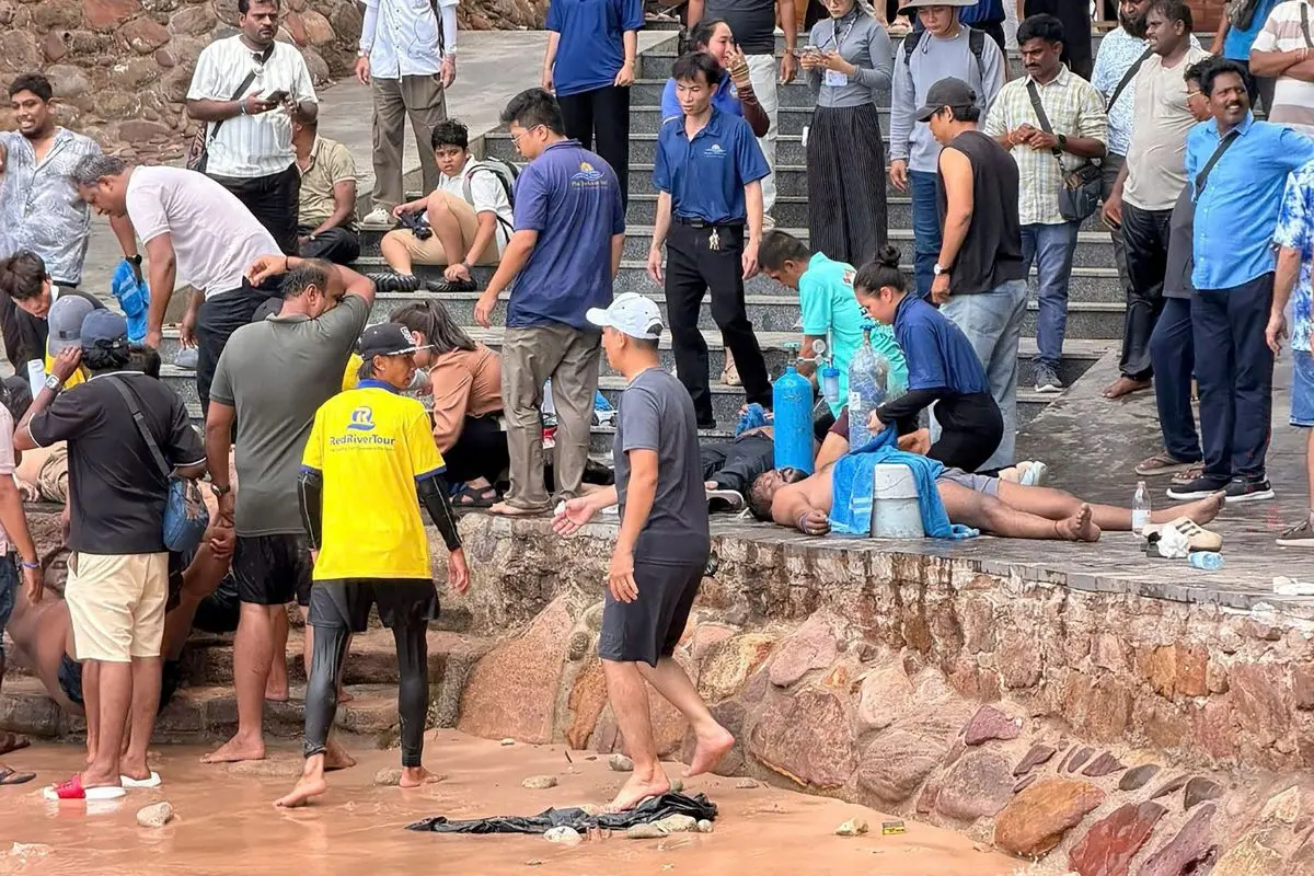People help victims of a boating accident after a tourist vessel capsized off Phu Quoc Island in southern Vietnam's An Giang Province on July 11, 2026. At least 15 people were killed when a tourist boat capsized off an island in Vietnam's south, state media reported on July 11. (Photo by AFP)