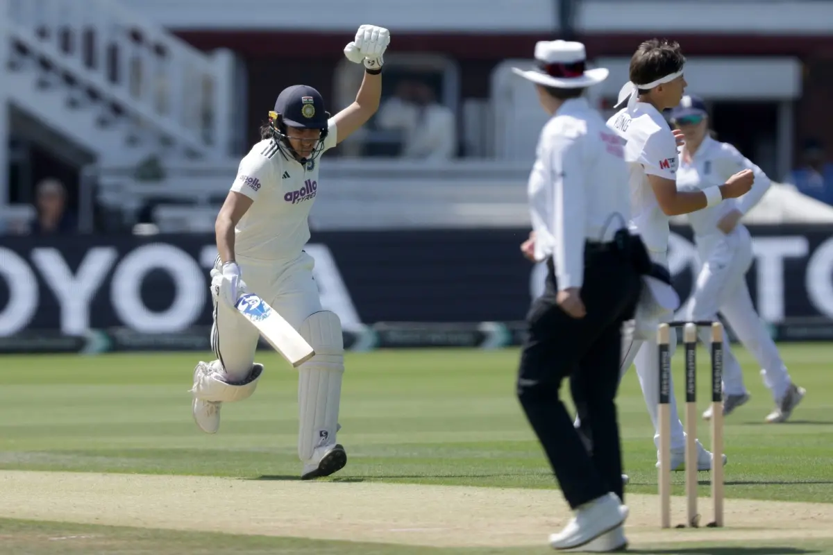 India's Yastika Bhatia celebrates as she runs between the wickets after reaching her hundred during day three of the first Women's Test match at Lord's | Photo: Steven Paston/PA via AP