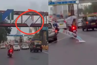 Huge banner drops onto moving biker in Thane; viral video raises safety concerns | WATCH