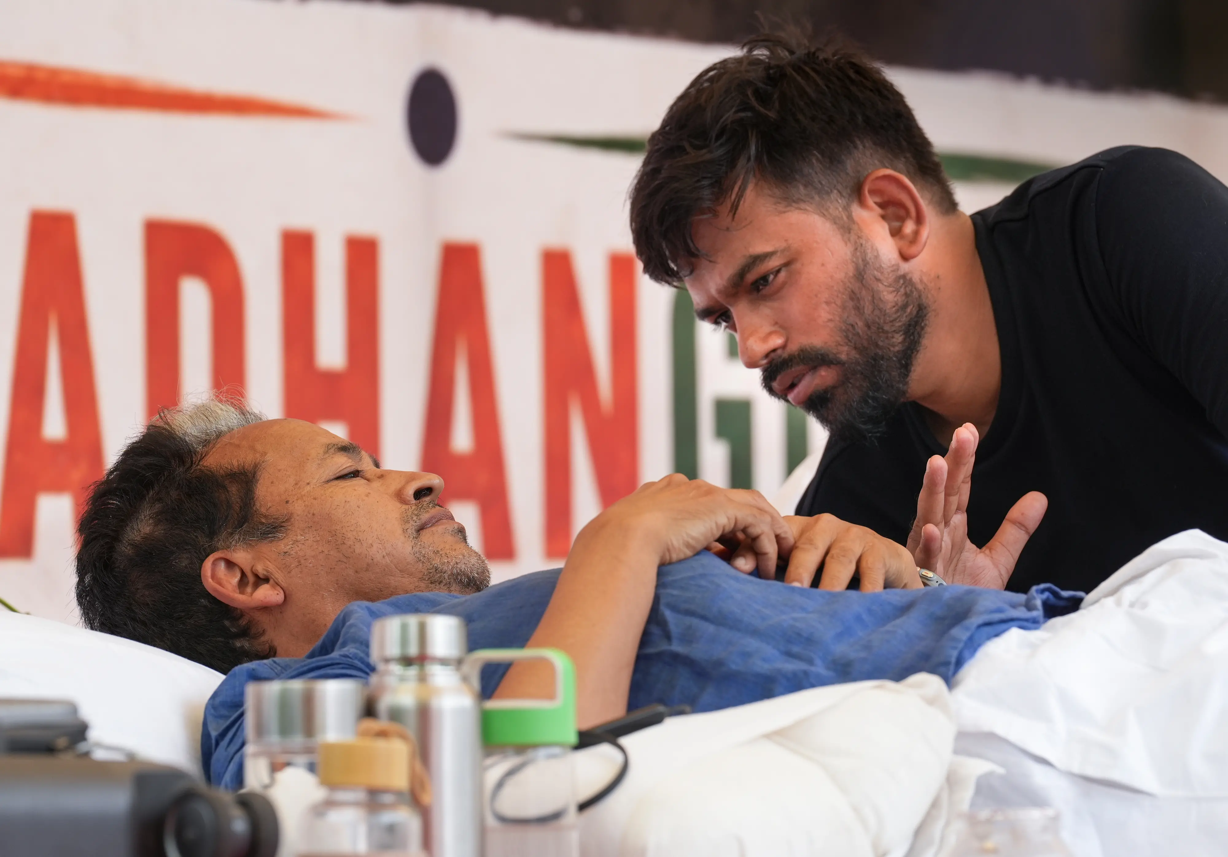 Climate activist and educationist Sonam Wangchuk interacts with Cockroach Janata Party (CJP) founder Abhijeet Dipke during a hunger strike organised by the Cockroach Janata Party (CJP), demanding action over alleged irregularities in examinations and seeking the resignation of Union Education Minister Dharmendra Pradhan, at Jantar Mantar, in New Delhi.| Photo: PTI