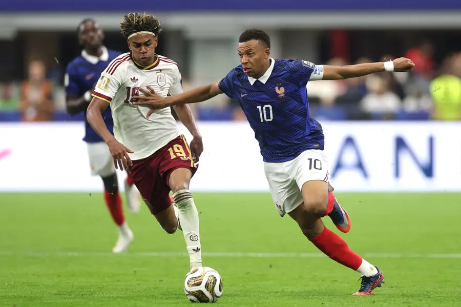 Mbappe competes for the ball against Yamal during the FIFA World Cup 2026 semi-final match between France and Spain