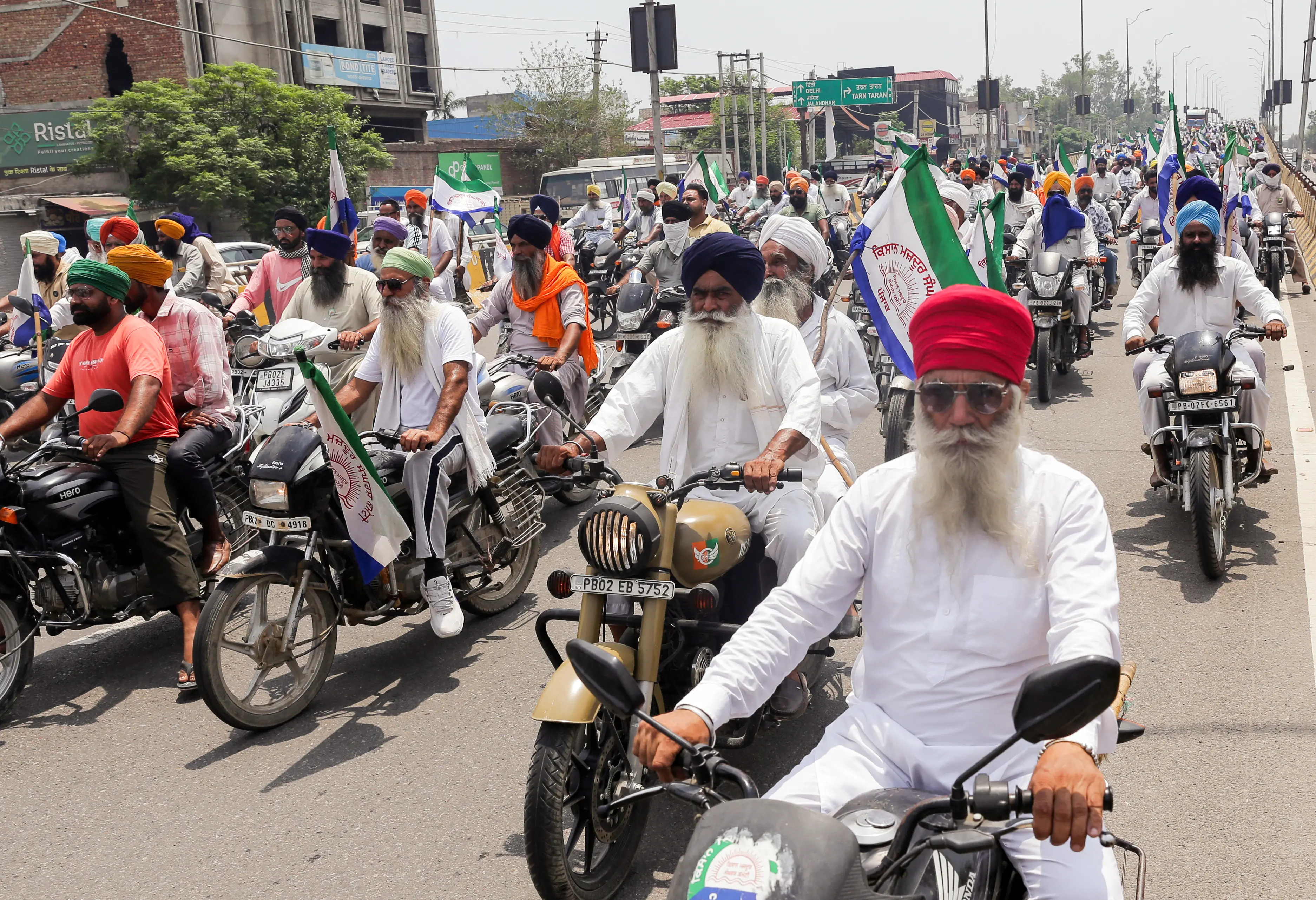Farmers from Kisan Mazdoor Sangharsh Committee take part in a motorcycle protest rally against the proposed Indo- US Trade deal, in Amritsar on Wednesday | Photo: ANI