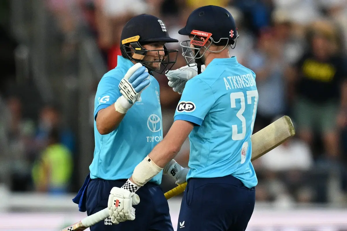England's Joe Root and England's Gus Atkinson celebrate winning the second one-day international (ODI) cricket match between England and India | Photo: AFP