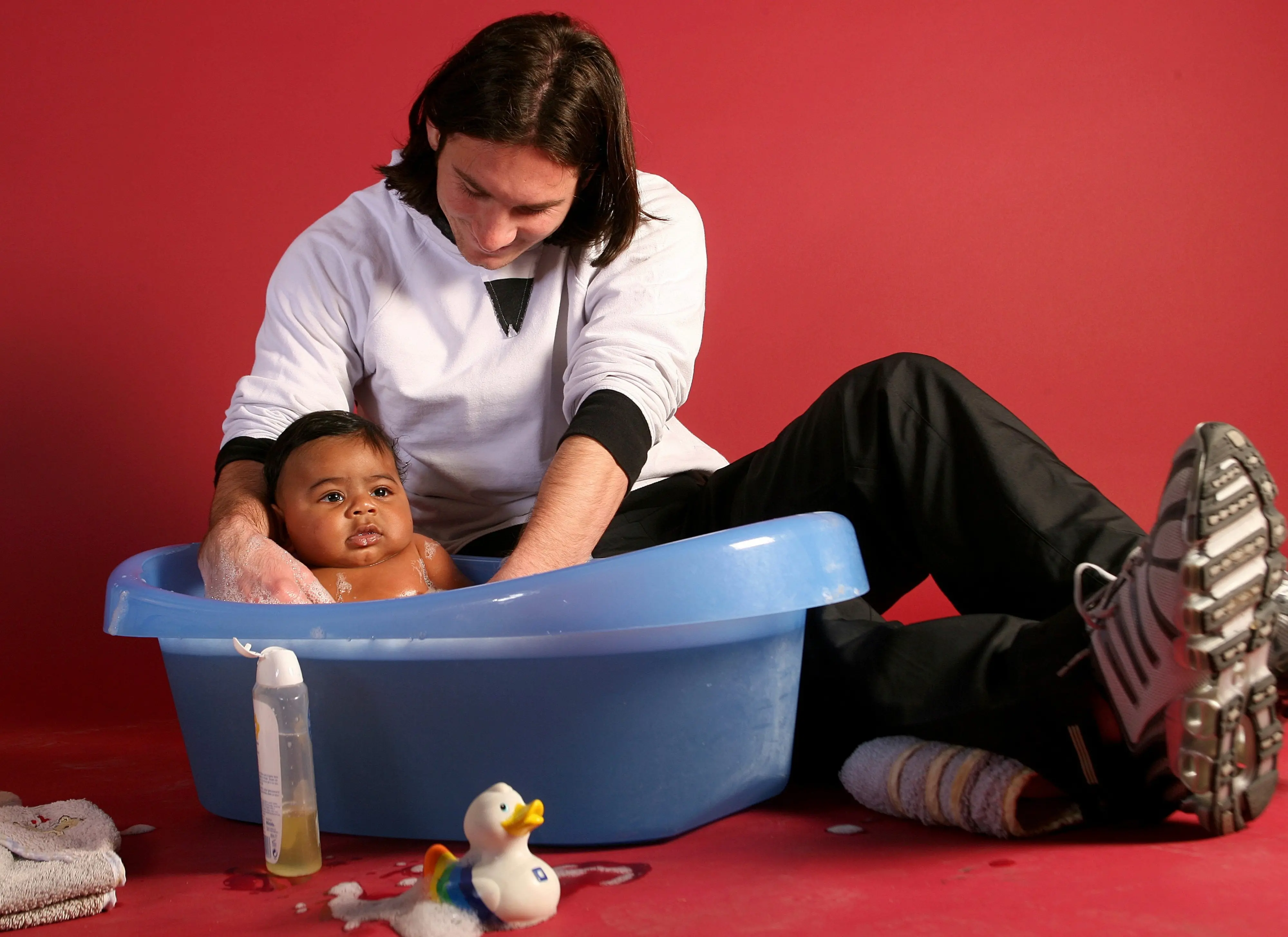 20-year-old soccer star Lionel Messi helps to bathe Lamine Yamal, who was merely six months old at the time, during a photo session in Sept. 2007 in the dressing room of the Camp Nou stadium in Barcelona | AP/PTI