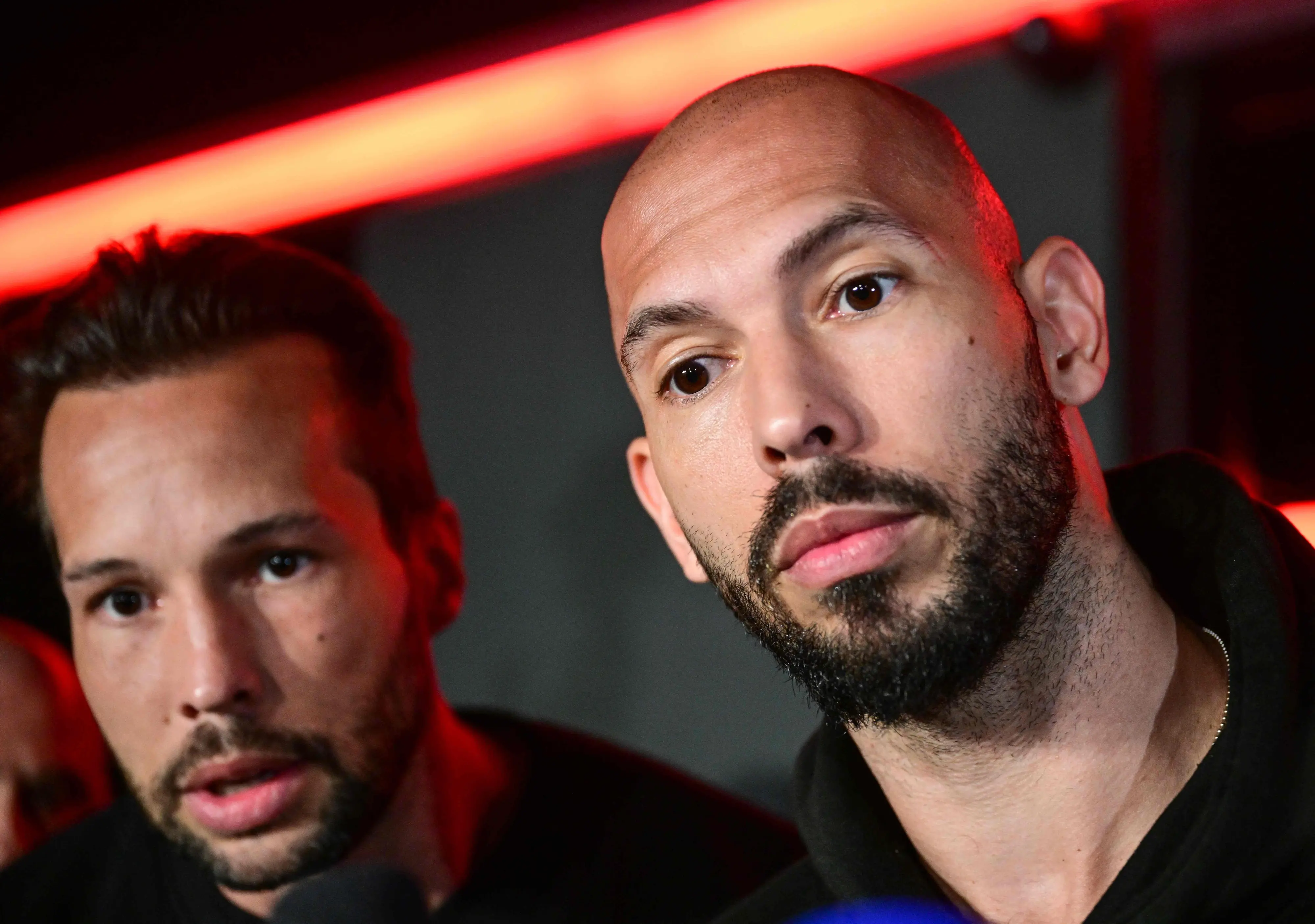 Andrew Tate (R) and his brother Tristan | AFP