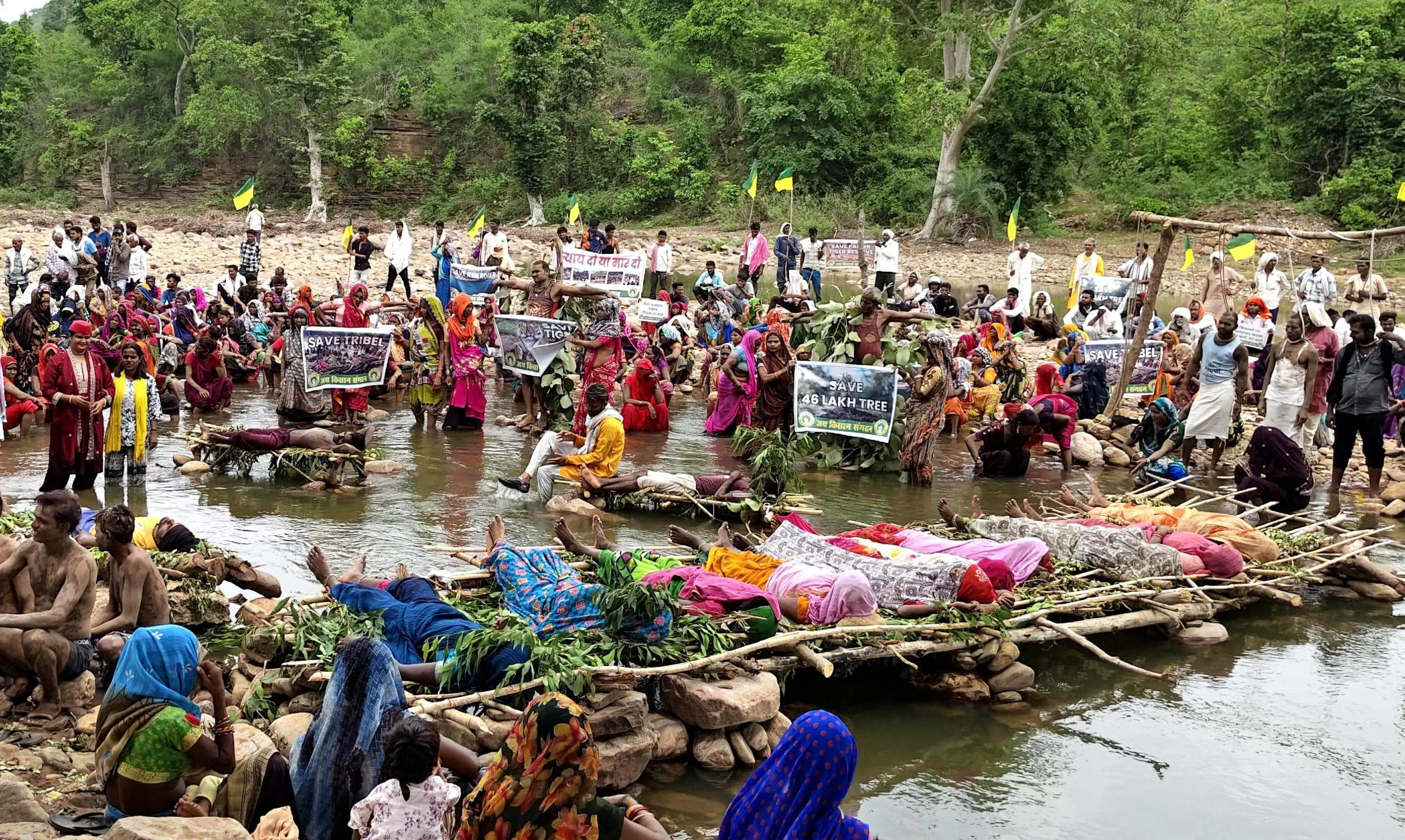 Tribal families affected by the Ken-Betwa river-linking project stage 'Chita Andolan' on the Barana River, in Chhatarpur.| Photo: ANI