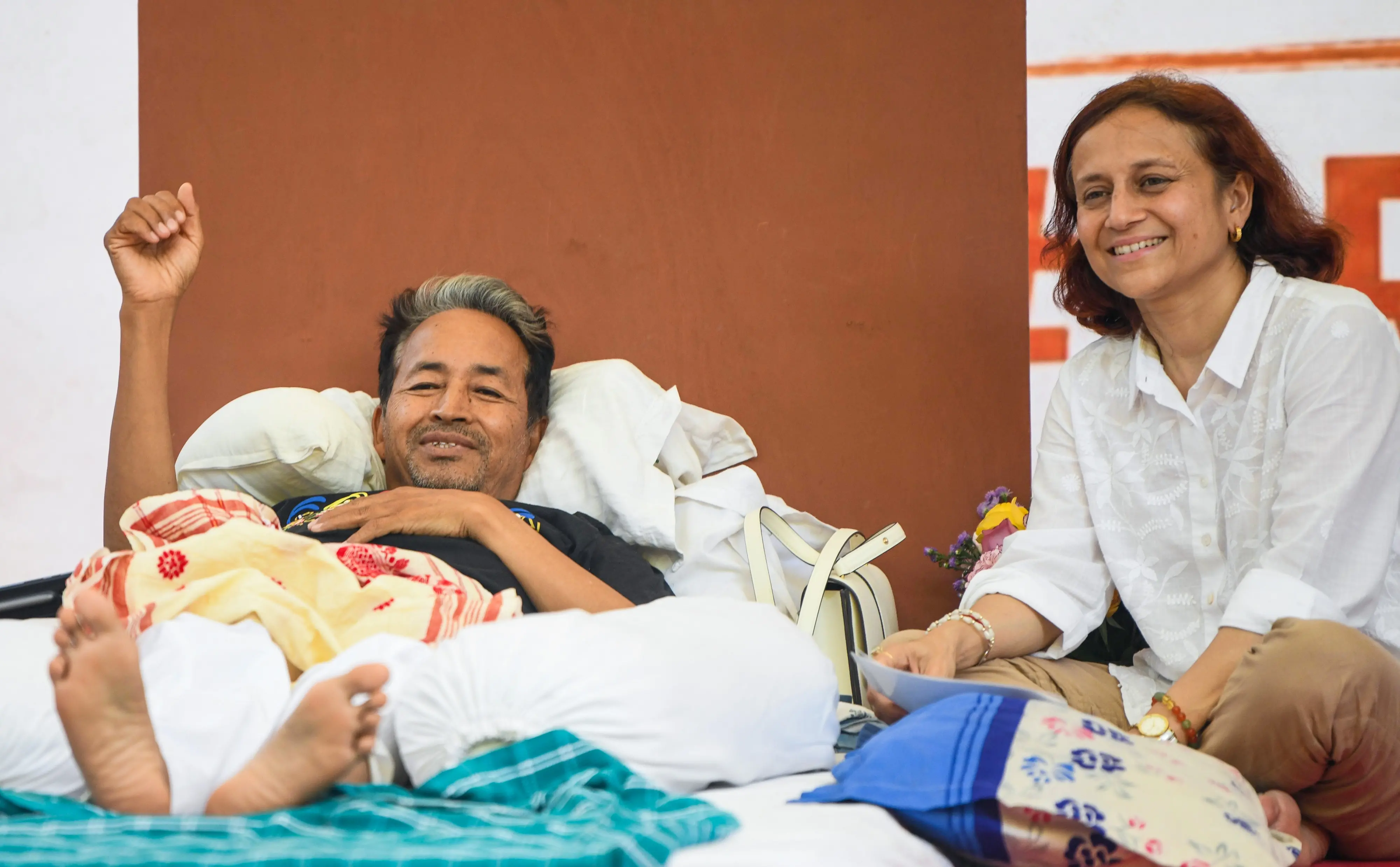 Environmentalist Sonam Wangchuk with his wife Gitanjali J. Angmo, on the 20th day of his indefinite hunger strike as part of the Cockroach Janata Party's (CJP) protest, demanding the Union Education Minister Dharmendra Pradhan's resignation over alleged examination irregularities and NEET paper leak, at Jantar Mantar in New Delhi on Friday.| Photo: ANI