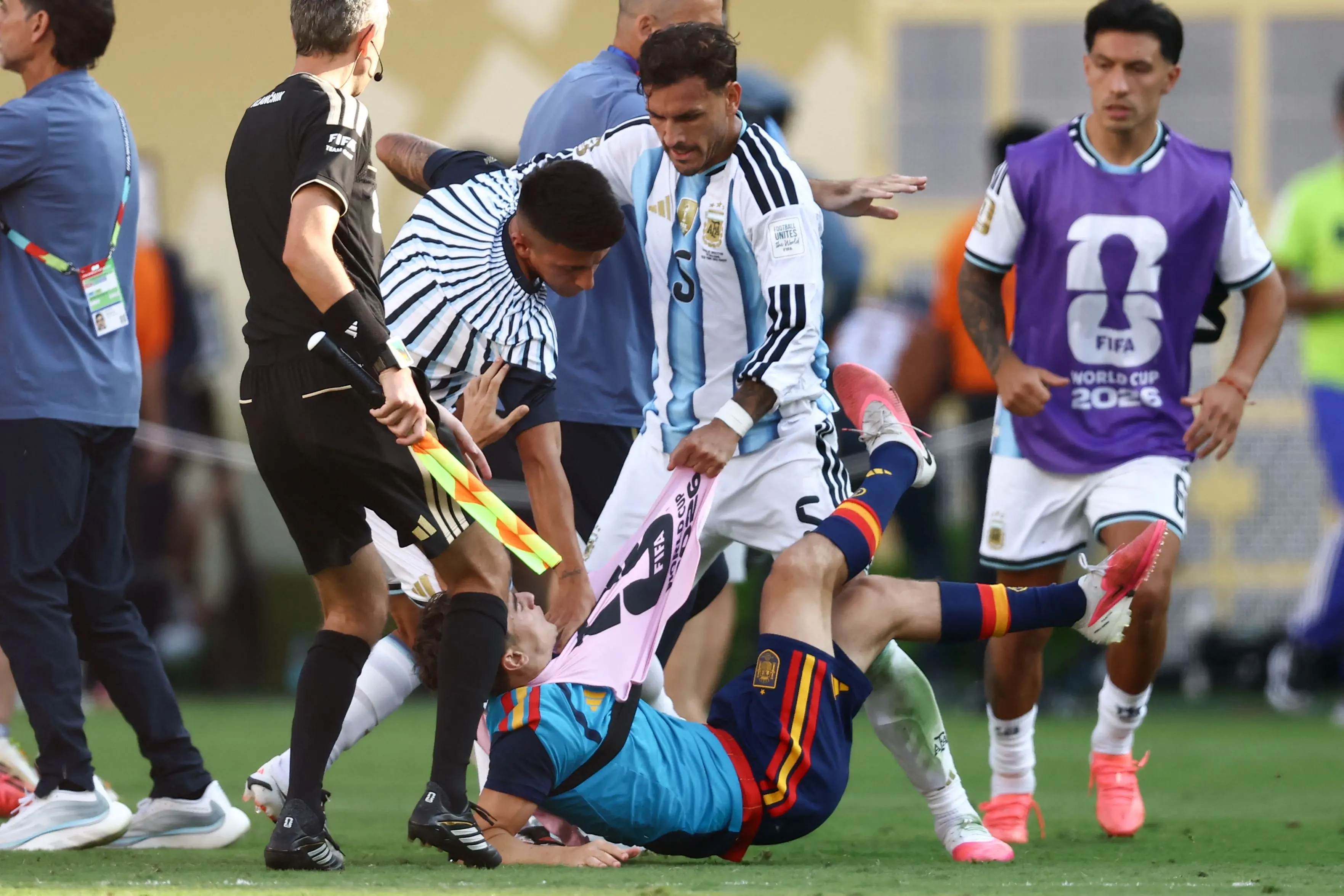 Argentina's midfielder Leandro Paredes (top) clashed with Spain's midfielder Gavi during the 2026 World Cup football tournament final match between Spain and Argentina | AFP