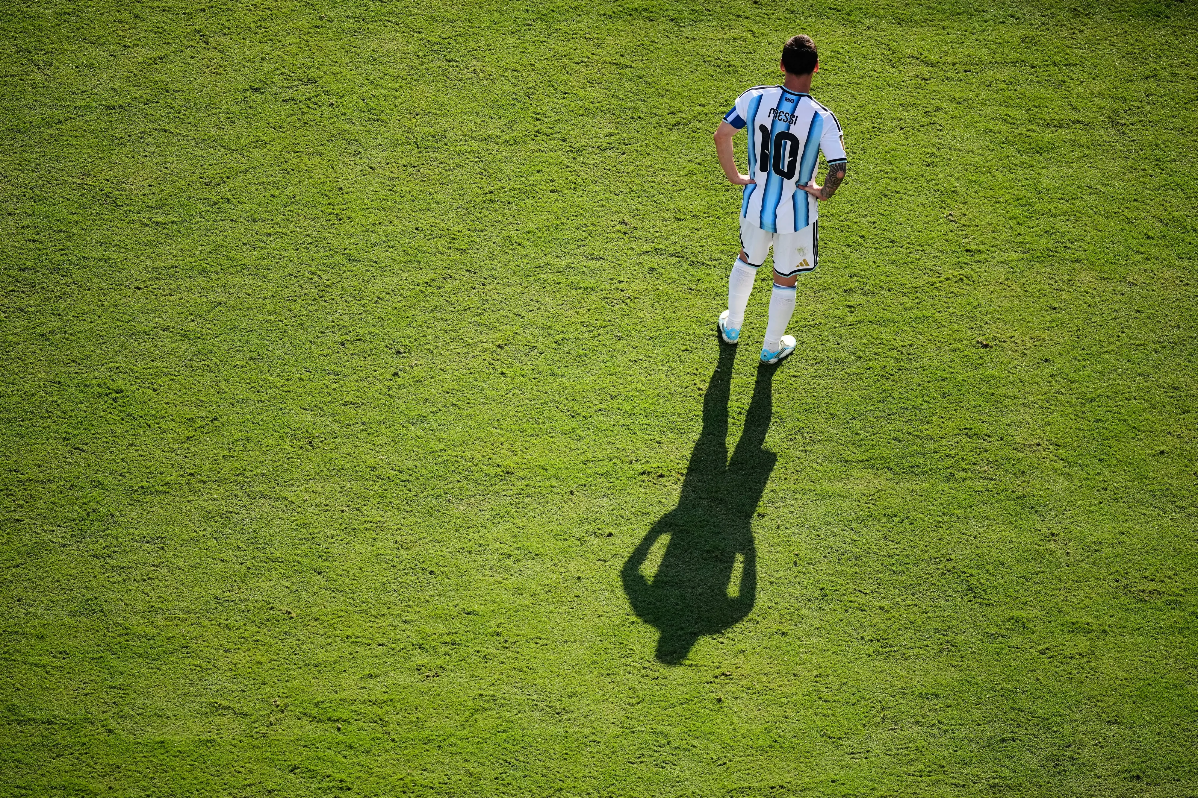 Lionel Messi casts a shadow during the World Cup final soccer match between Spain and Argentina | AP