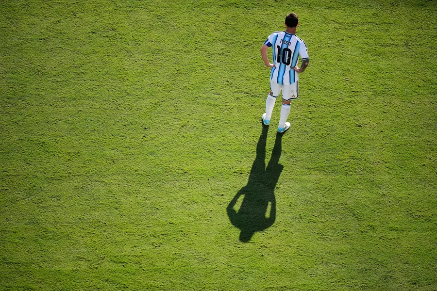 Lionel Messi casts a shadow during the World Cup final soccer match between Spain and Argentina