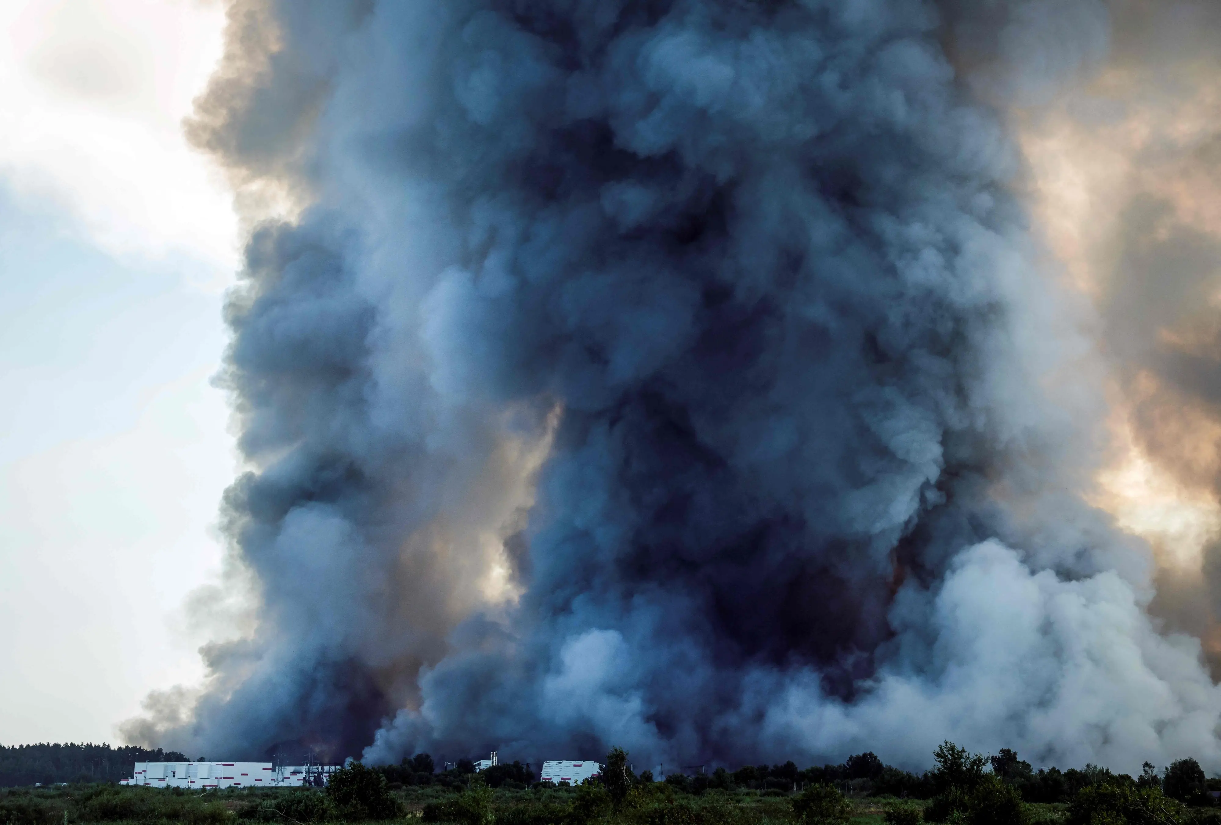 This photograph shows the smoke of a fire at the Russian e-commerce firm Wildberries' logistics complexes in the town of Elektrostal outside Moscow | AFP